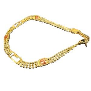 Golden pulcera, with pink zirconia stones (18k laminated gold)